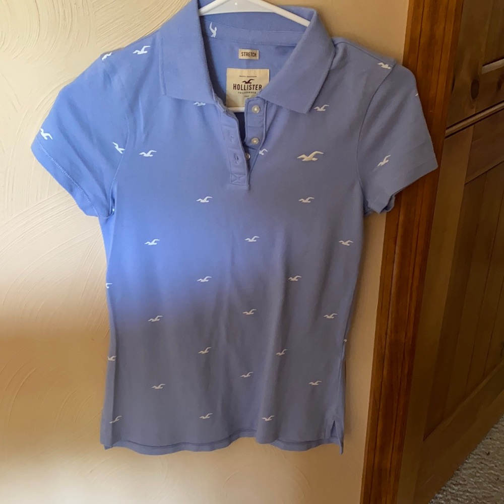 Women’s blue button up collared shirt